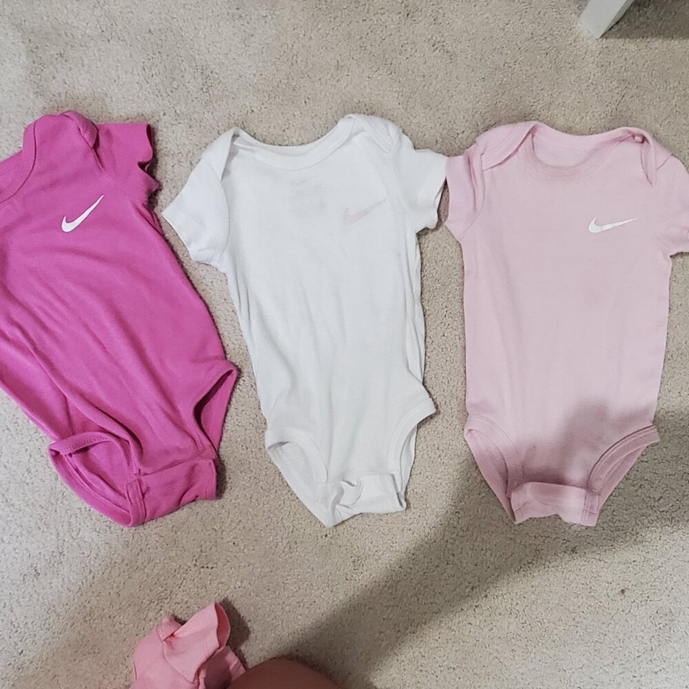3 Nike onesies